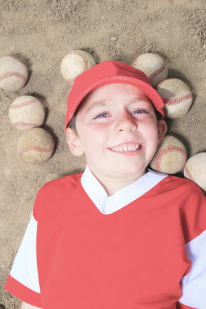 A nice child happy to play baseballの写真素材