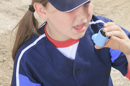 A baseball player having a asthma crisisの写真素材