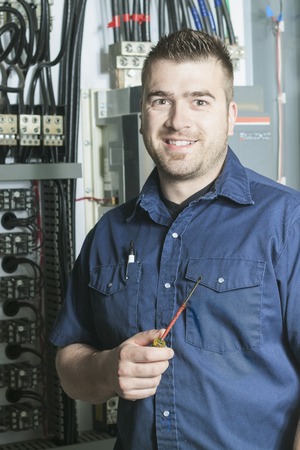 A Portrait of an electrician in a roomの写真素材