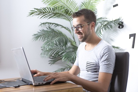 A Men play video game in the kitchen room