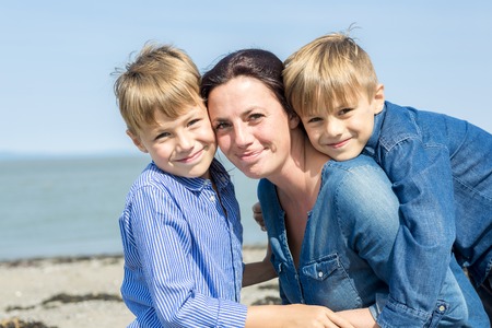 A Portrait of a Family having fun at the beachの写真素材