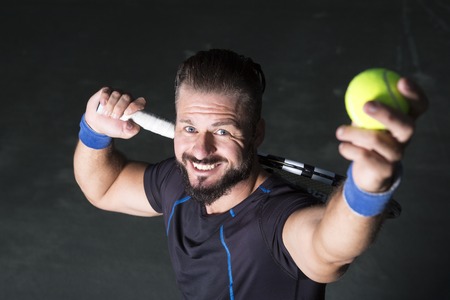 A tennis player having fun to playの写真素材