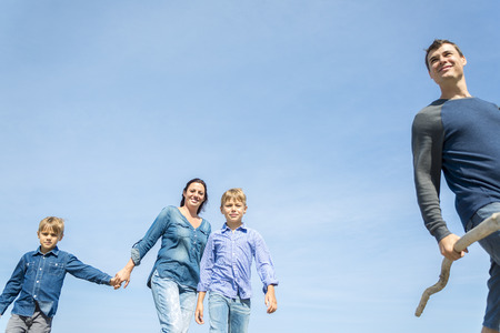 A Portrait of a Family having fun at the beach