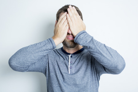 A Portrait of a men in studio gray background