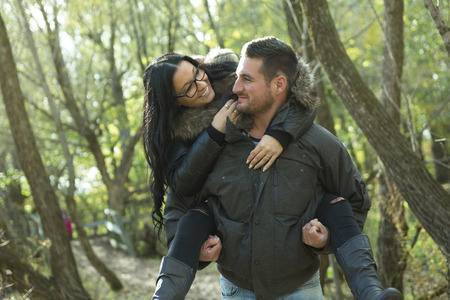 A Happy middle aged couple outdoors on beautiful autumn dayの写真素材