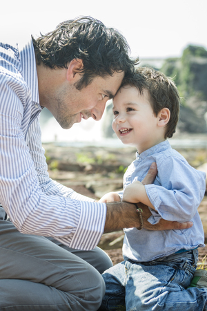 An happy joyful father having fun with is childの写真素材
