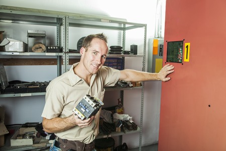 An Elevator Repair Man at work employee