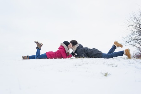 Two nice teenagers havinf fun on the snow field