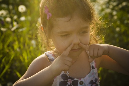 A Portrait of five years old caucasian child girl sunsetの写真素材