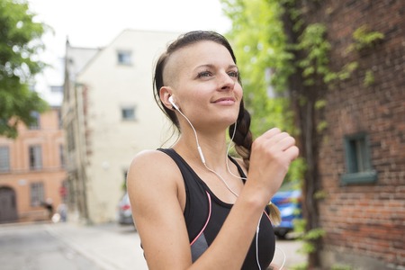 A Young female runner in old city center