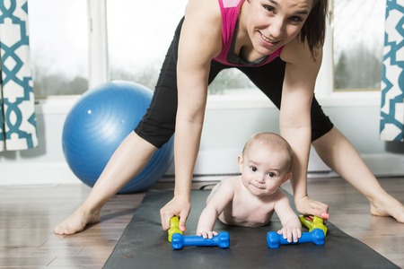 A Mother with child boy doing fitness exercisesの写真素材