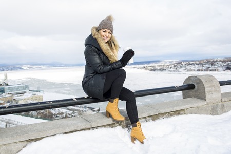 A glamorous winter portrait of a girl outsideの写真素材