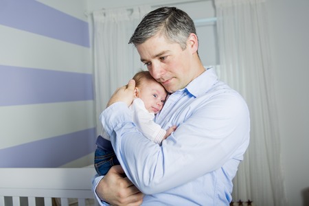 A Father and baby at home together, bedtime