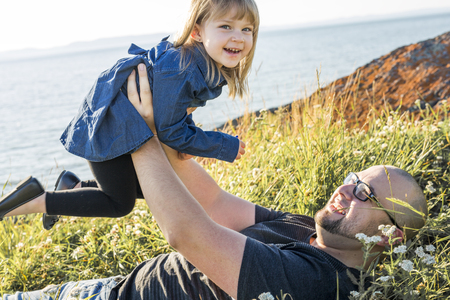 A father and is child enjoying their vacation at the seaの写真素材