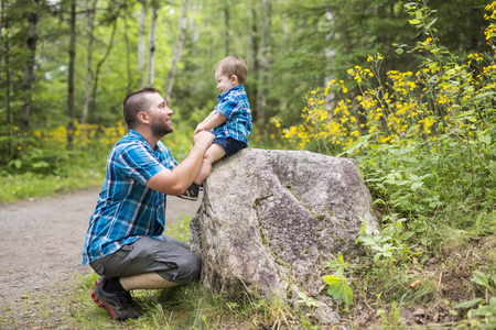 A Father and his son in the forestの写真素材
