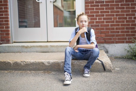 Nice Pre-teen boy outside at school having good time