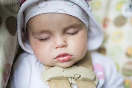 Cute little baby sleeping at homeの写真素材