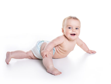 Sweet little girl on the floor of studio white backgroundの写真素材