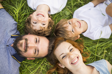 An Happy family having taking good time in the meadowの写真素材