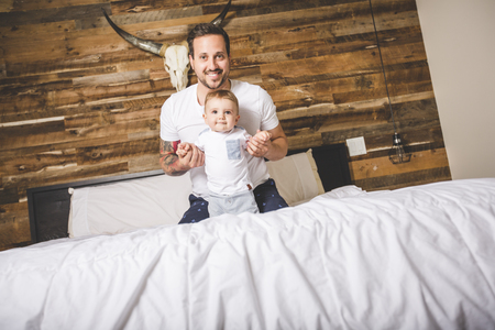 Portrait of a father with her nine months old babyの写真素材