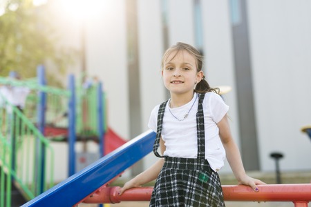 cheerful school age child play on playground school