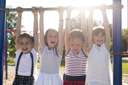 cheerful school age child play on playground school