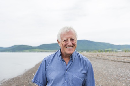 Senior Man at the beach having good time