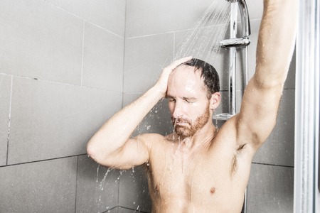 Handsome man in showerの写真素材