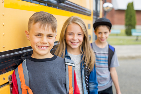 Great Portrait Of School Pupil Outside Classroom Carrying Bags