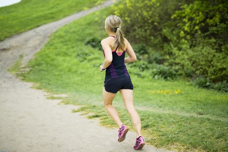 portrait of a woman jogging outdoors
