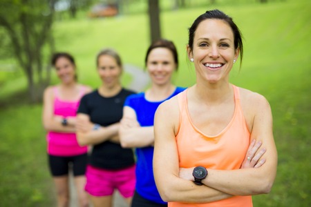 group of people enjoying in the fitness having fun running outside