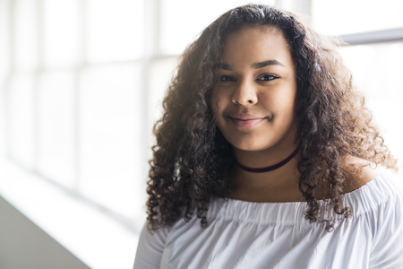 young pretty african-american girl posing cheerfulの写真素材