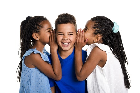 portrait of happy three black childrens, white backgroundの写真素材