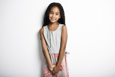 Adorable african little girl on studio gray backgroundの写真素材