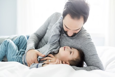 Father and son in bed, happy time on bed