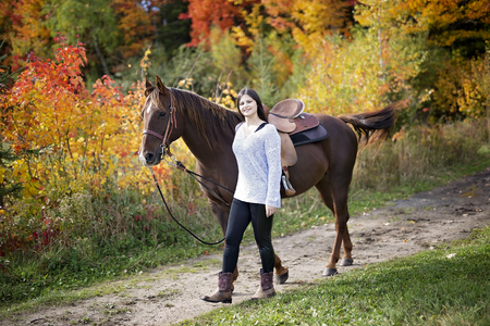 Beautiful girl with black hair   horseの写真素材