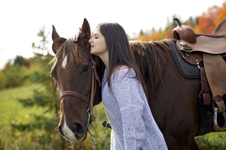 Beautiful girl with black hair   horseの写真素材