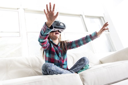 A nice Girl wearing virtual reality goggles