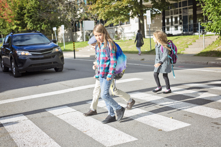 school children crossing the streetの写真素材