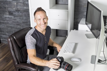 Handsome photographer camera officeの写真素材