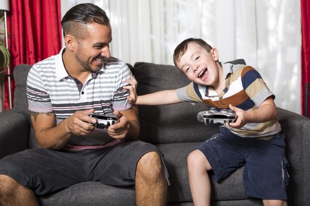 Father and son playing video game