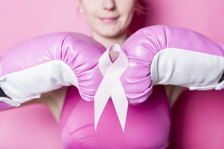Fight for Breast Cancer woman with symbol on pink backgroundの写真素材