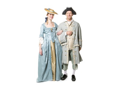 A beautiful couple in long medieval dress isolated on white