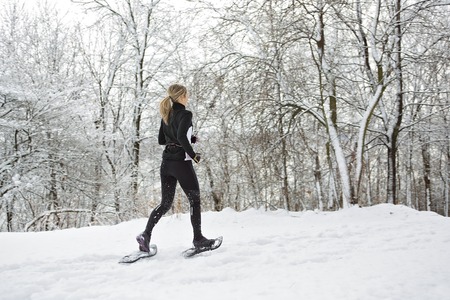 A Fitness running woman in winter seasonの写真素材