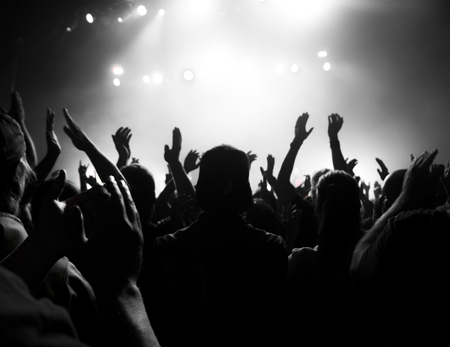 a crowd shadow of people at during a concertの写真素材