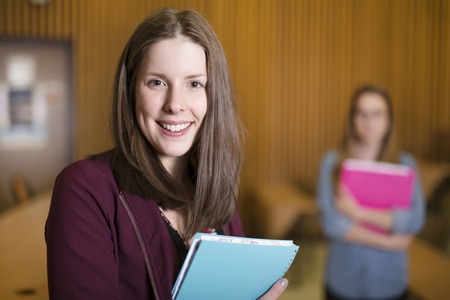 A Studying young teenage college student girl in a schoolの写真素材