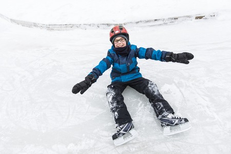 A little boy enjoying ice skating in winter seasonの写真素材