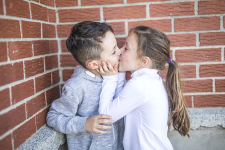 the First love and kiss two happy cute kids meetingの写真素材