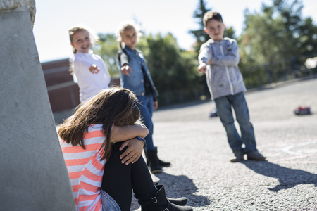 Elementary Age Bullying in Schoolyardの写真素材