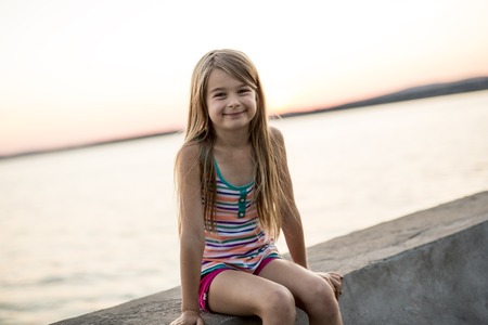 Portrait girl in sunset sky